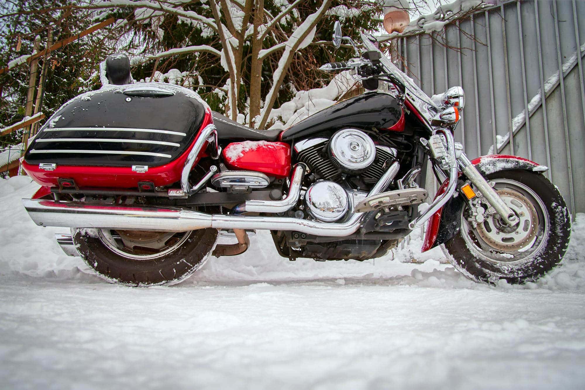 Motorcycle in the winter parking lot at the house