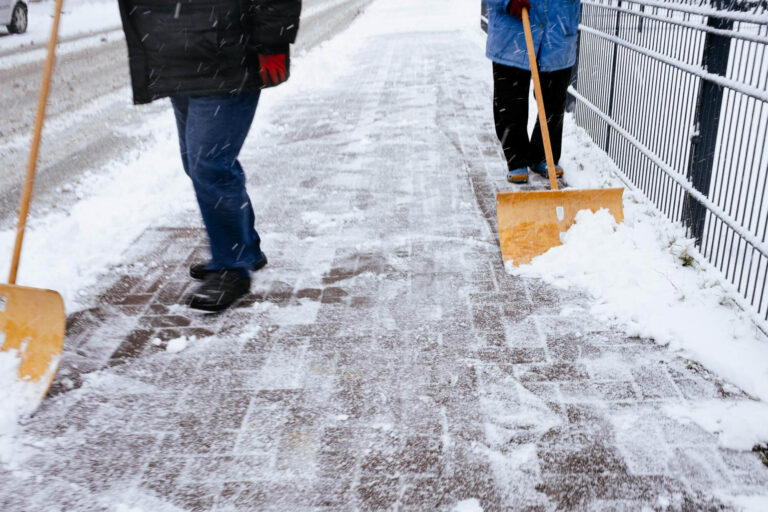 Cleaning ice from sidewalk