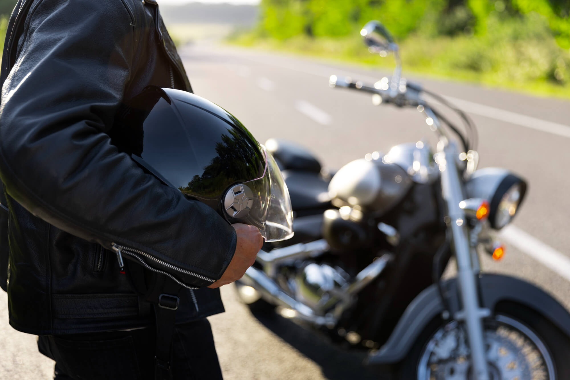 Side view man with a motorbike